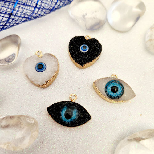Blue Eye aka Evil Eye Sparkly Pendant (assorted designs. resin in gold metal)