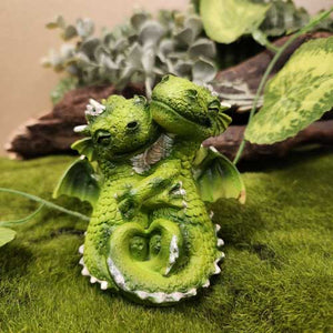 Green snuggling dragons
