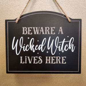 Beware a Wicked Witch Lives Here Sign