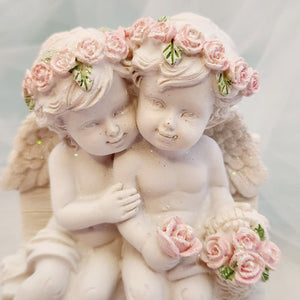 Cherub Couple on Chair