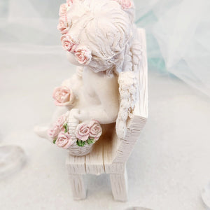 Cherub Couple on Chair