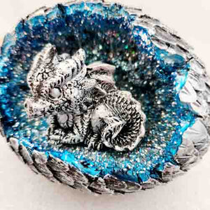 Silver dragon in silver egg with LED