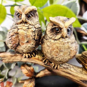 Three Owls on Branch