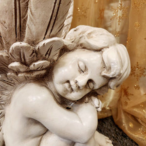 Sleeping Cherub (left)