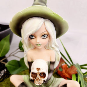 Green Witch Holding Skull