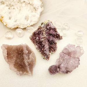 Flat amethyst druzy plate with sparkling purple crystal surface.