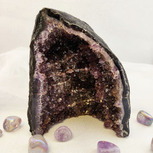 Amethyst geode showing deep purple points in natural cavern.