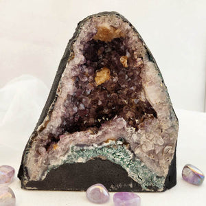Amethyst geode showing deep purple points in natural cavern.