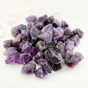 Tiny raw amethyst pieces with natural rough texture and mixed tones