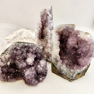 Large standing Amethyst clusters with mixed small points and natural shimmer.