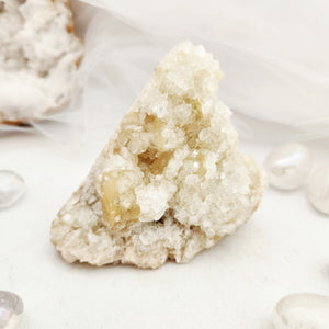 Apophyllite and stilbite cluster with dense, sparkling white crystal points