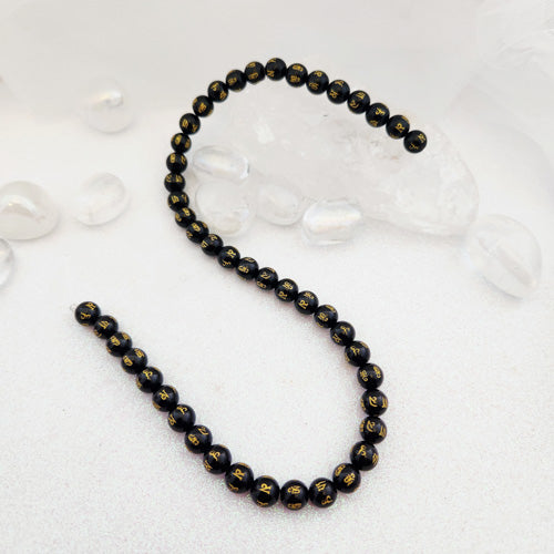 Black Obsidian Om Mane Padme Hum Bead Strand (approx. 46-48x8mm beads)