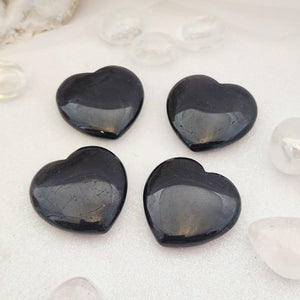 Polished Black Tourmaline heart with deep black tone and smooth finish.