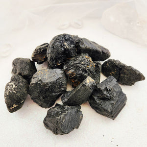 Black Tourmaline crystal rough rock with natural striations, supporting protection and grounding energy