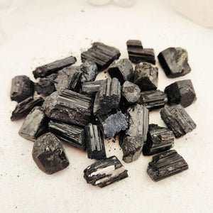 Black Tourmaline crystal rough rock with natural striations, supporting protection and grounding energy