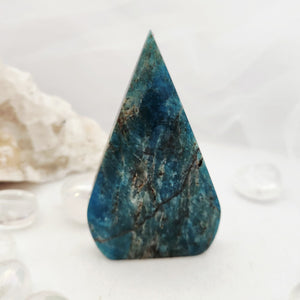Triangular blue apatite flame with a smooth polished tapered form.