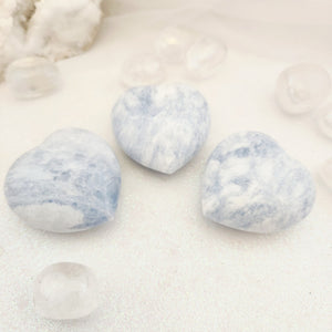 Polished blue Calcite heart with soft pale blue colouring.