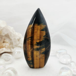 Tapered tiger's eye flame with a smooth rounded point.