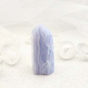 Blue Lace Agate polished point with soft blue and white banding in a standing crystal point shape