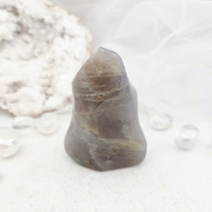 Polished blue rose quartz flame with soft bluish colouring.