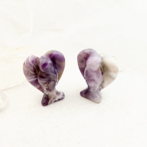 Chevron amethyst carved angel showing purple and white banding.