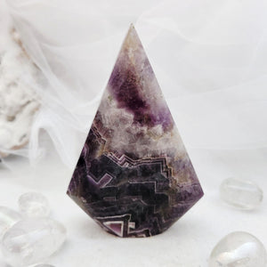 Polished chevron amethyst flame with a tapered point and bold purple banding