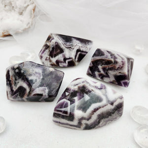 Polished chevron amethyst free forms with bold purple and white banding