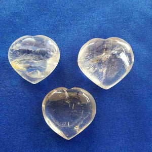 Polished clear quartz heart with smooth shape and soft translucency.