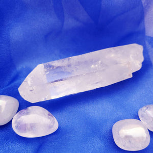 Elongated clear quartz point, natural tip at one end, broken other.