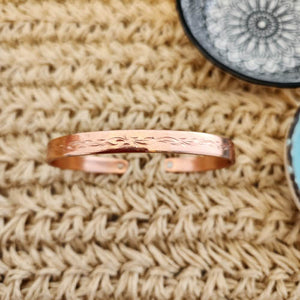 Engraved copper magnetic bracelet with botanical design, reddish-gold finish