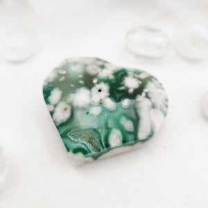 Polished flower agate heart with green base and white floral patterning