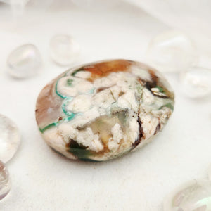 Smooth flower agate palm stone with cream, green and rust patterning