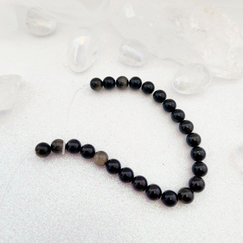 Gold Sheen Obsidian Bead Strand (assorted. approx. 22 beads. round. 8mm)