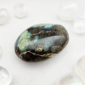 Smooth labradorite palm stone with green-blue flash and golden veining