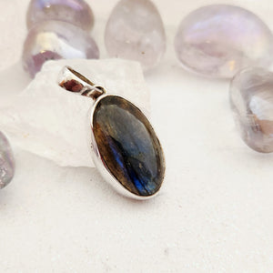 Oval labradorite pendant in sterling silver bezel setting with bail