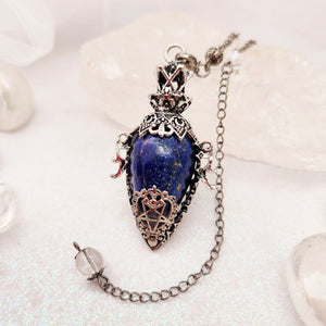 Ornate silver-caged pendulum with deep blue lapis lazuli teardrop stone.