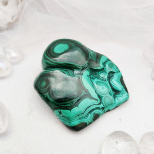 Polished malachite free form with bold green banding and circular patterns