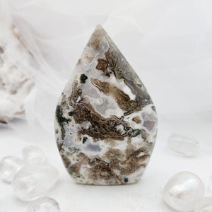 Polished moss agate flame with a tapered point and earthy mossy patterns