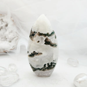 Polished moss agate flame with a tapered point and mossy green patterns