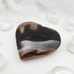Polished banded agate heart with dark brown and pale grey banding