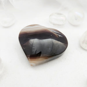 Polished banded agate heart with grey, brown and cream layers