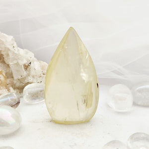 Smooth citrine flame with a rounded top and pale golden hue.