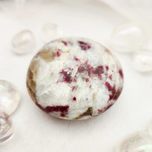 Palm stone with cream quartz and scattered red tourmaline flecks
