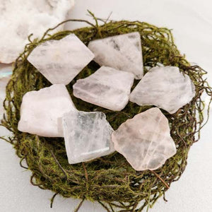 Soft pink polished rose quartz slab with smooth flat shape.