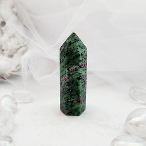Polished ruby in zoisite point with deep green tone and pink flecks