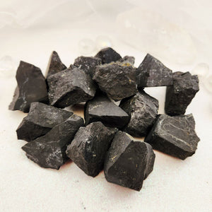 Shungite crystal rough rock with natural black surface, supporting protection and grounding energy