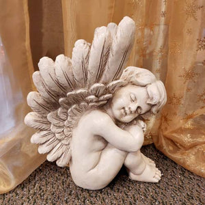 Sleeping Cherub (left)