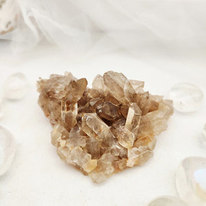 Natural smoky quartz cluster with varied grey-brown points