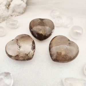 Polished Smoky Quartz heart with soft brown tones and gentle translucence.