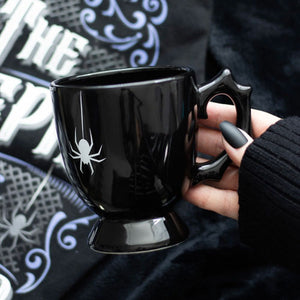 Black ceramic spider mug with detailed spider design, full product view